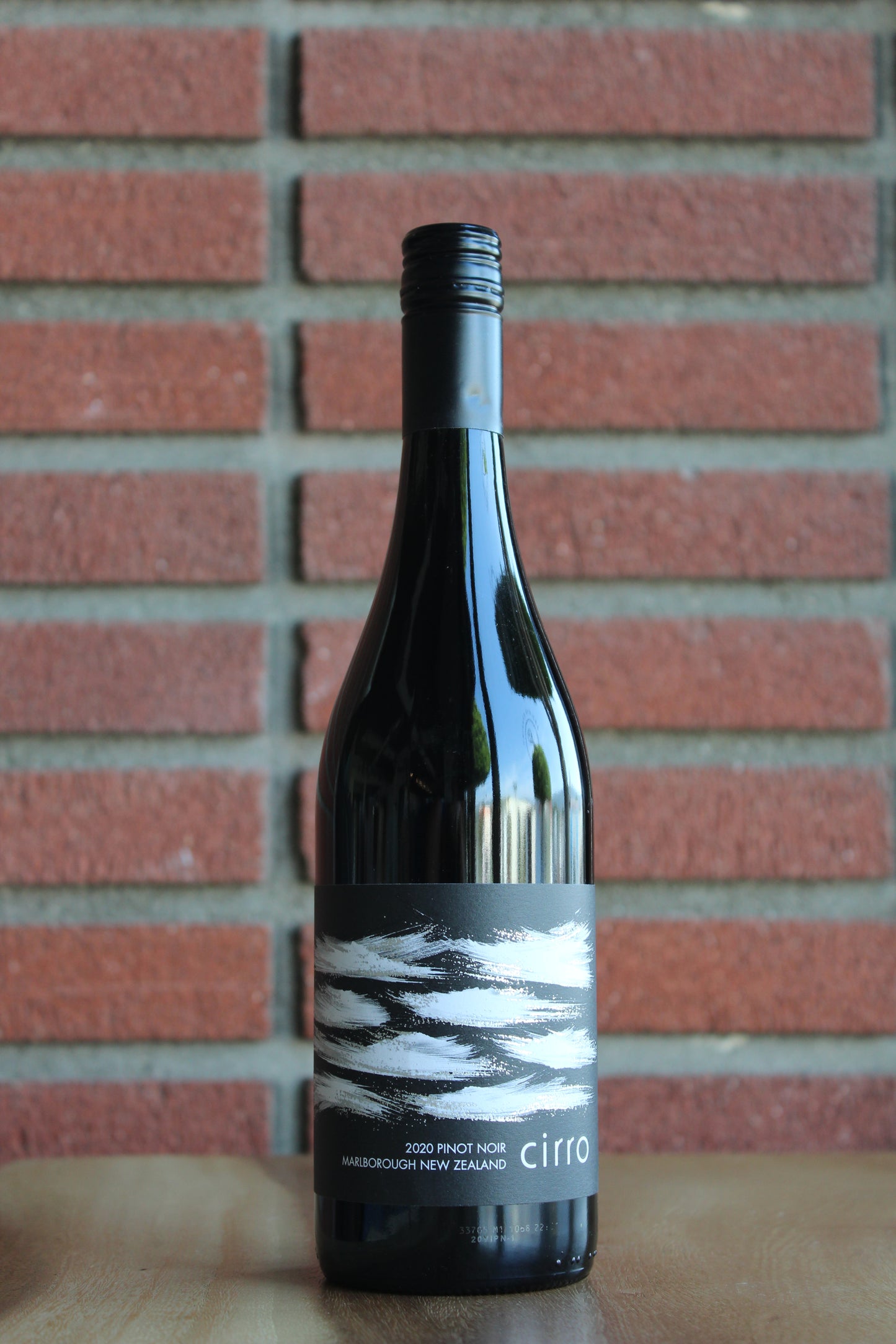 Cirro Winery Pinot Noir bottle against a brick background
