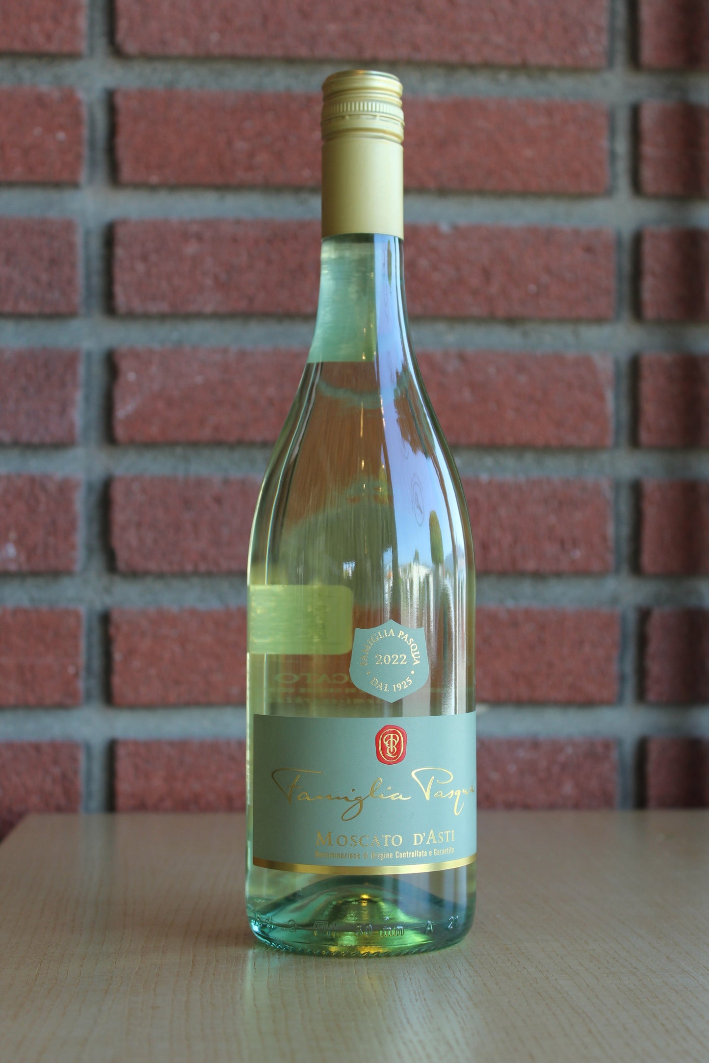 Famiglia Pasqua Moscato d'Asti Bottle on a brick background