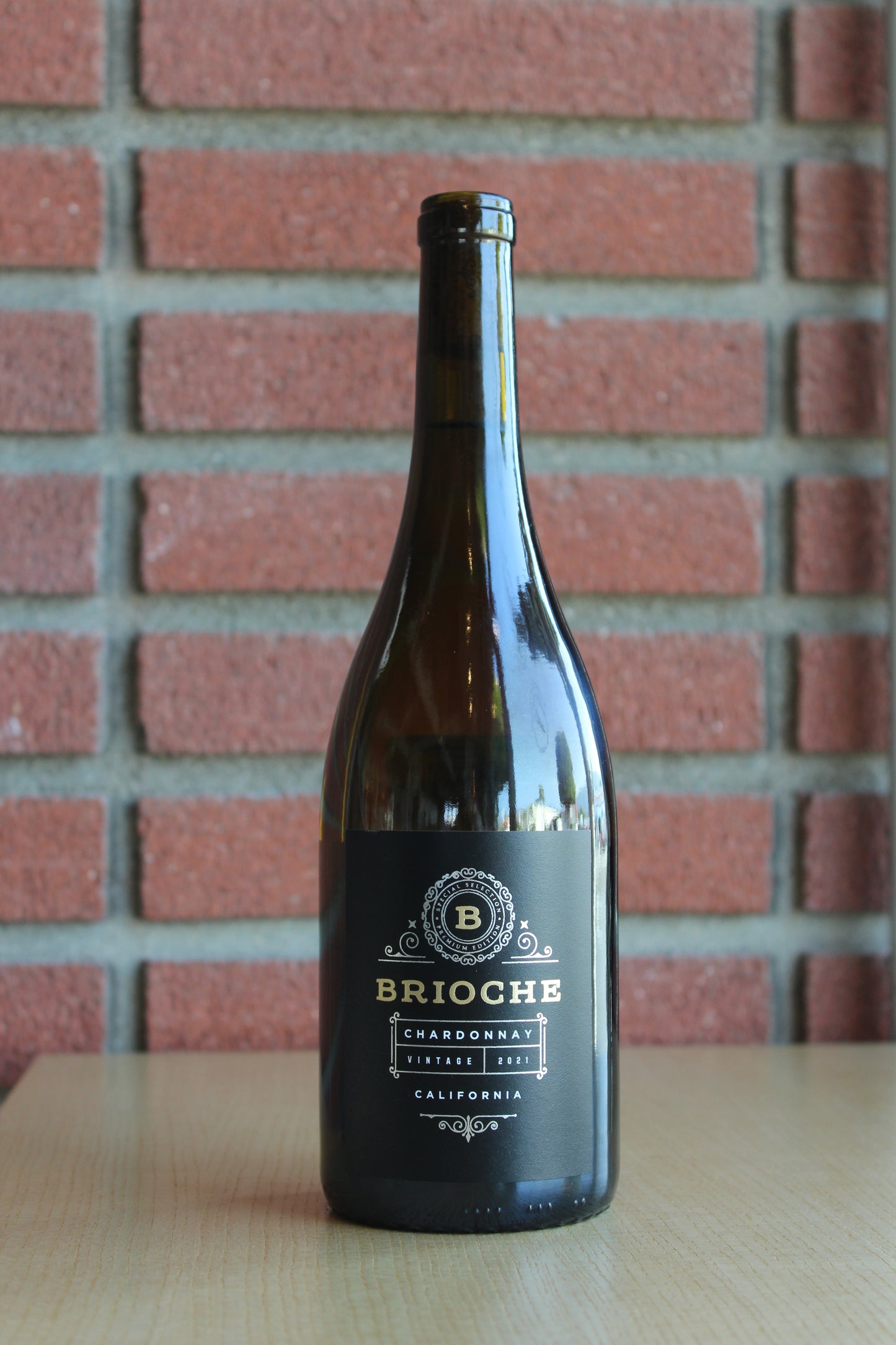 Brioche California Chardonnay bottle on a brick background