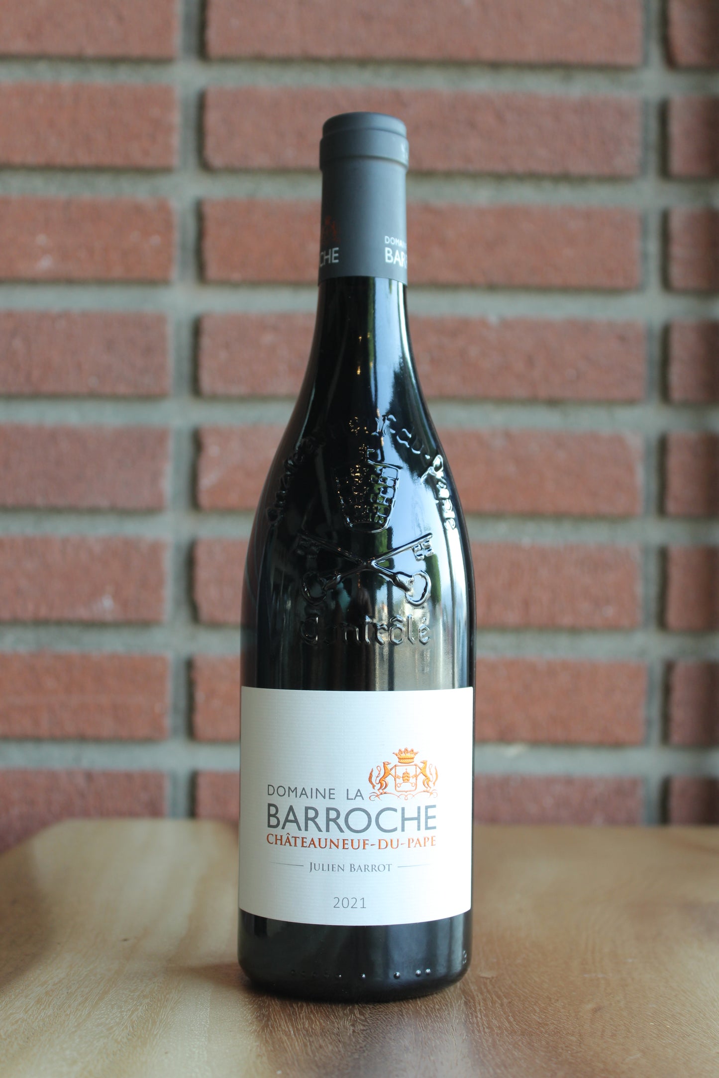 domaine la barroche chateauneuf du pape hulien barrot 2021 bottle on a brick background