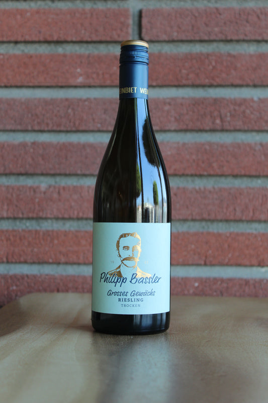 Philipp Bassler Grosses Gewachs Riesling Wine bottle with a label on a red brick surface