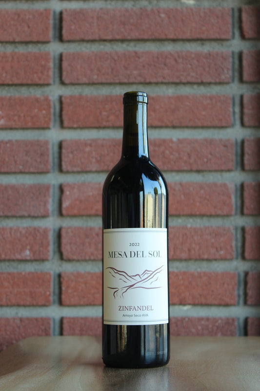 Bottle of Mesa del Sol Zinfandel 2022 wine on a red brick background