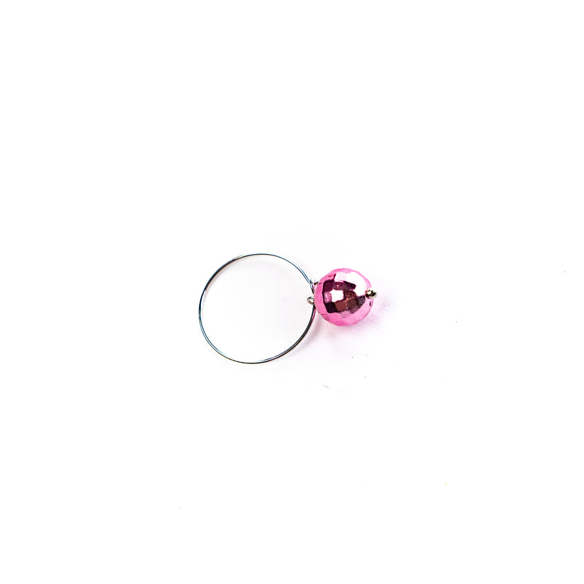 Pink discoball  charm on  a white background